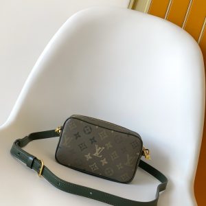 Alternative view of P520¥•Monogram coated canvas•Distressed cowhide leather trim•Fabric lining•Distressed metal hardware•Zip closure•Main compartment•Front corner reinforcement•Front appliqué•Shoulder strap: Detachable, adjustable•Strap length: 42.0 cm•Adjustable strap length: 55.0 cm